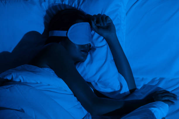 istock Woman sleeping with a sleep mask on her eyes 1194352777