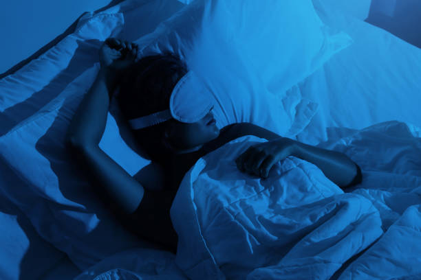 istock Woman sleeping with a sleep mask on her eyes 1194353326