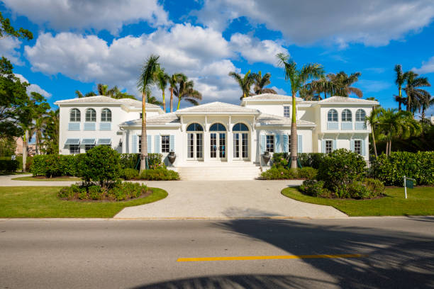 Naples Florida Luxury Home Naples, Florida USA - November 1, 2017: Classic architecture style home in the historic coastal gulf residential district of Old Naples. collier county stock pictures, royalty-free photos & images