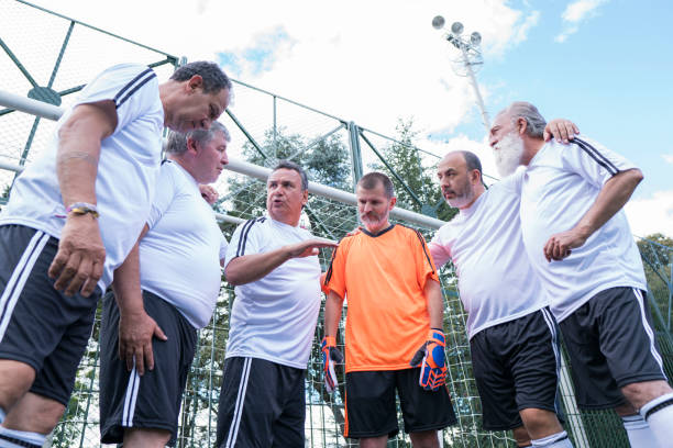 istock gentlemen's soccer team giving support before starting their match 1194360299