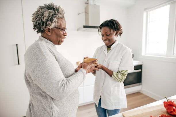 istock Home caregiver assistance 1194372175