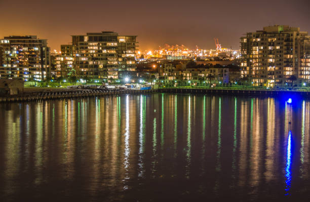 istock Container terminal behind condominiums at night in Melbourne, Australia. 1194373931