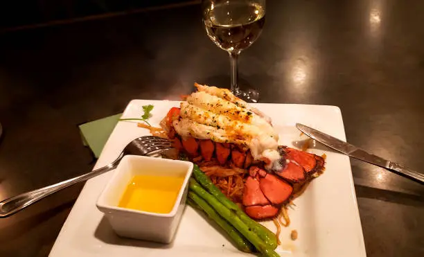 Photo of Lobster tail dinner on white platter