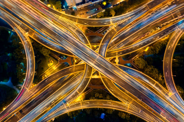 istock Urban highway traffic shanghai at night 1194378487