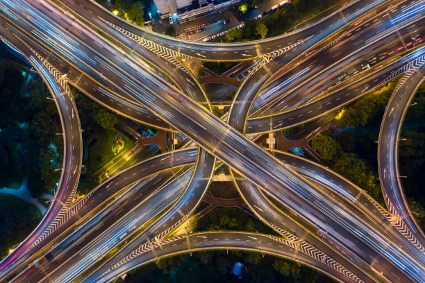 istock Urban highway traffic shanghai at night 1194378662