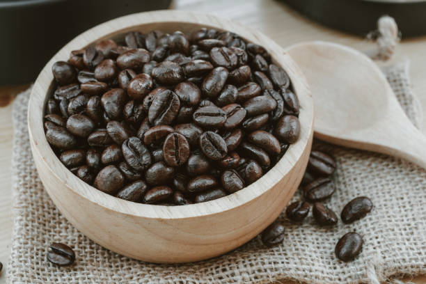 istock Coffee bean on wooden bowl with home made coffee background 1194382735