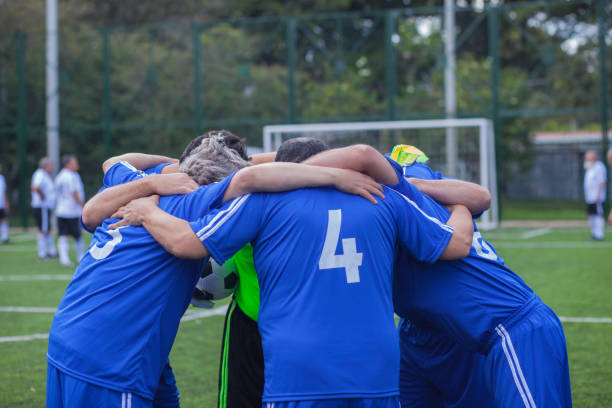istock gentlemen's soccer team hugged before the game 1194382774