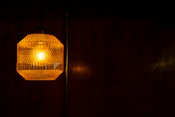 istock Yellow retro luminaire. concrete background 1194383667