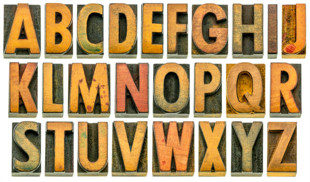 English alphabet in wood type isolated English alphabet in wood type - 26 isolated letters in letterpress printing blocks with a lot of character due to scratches and ink stain, shot at slight angle for 3D effect printing block photos stock pictures, royalty-free photos & images