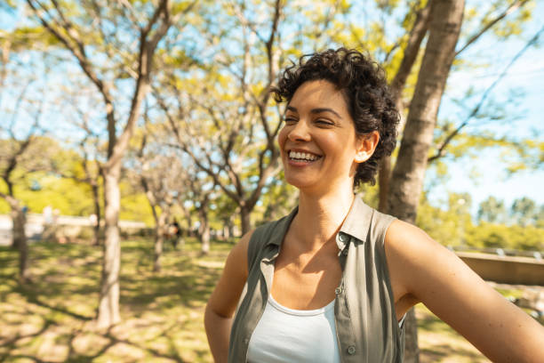 istock Woman relaxing and walking at the park 1194387408
