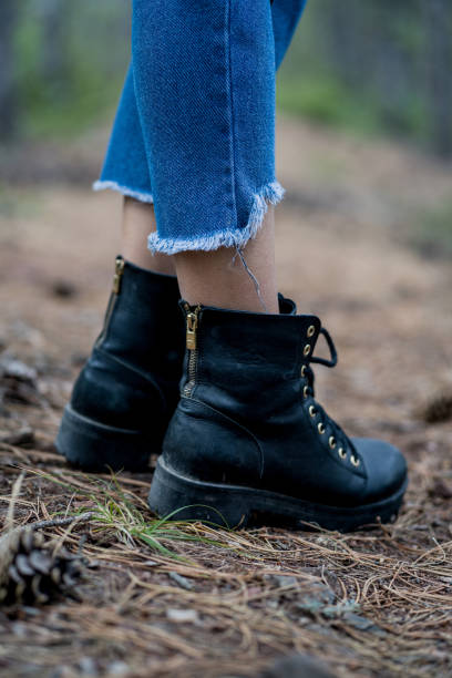 istock unisex black boots 1194390378