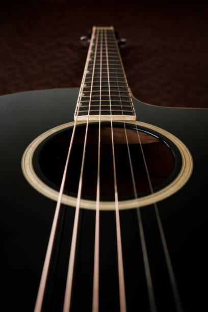 istock Black acoustic guitar 1194391250
