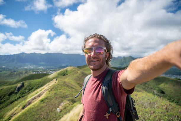 istock Young man takes selfie at on mountain hike 1194392928