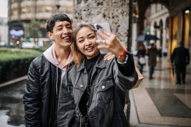istock Young couple taking selfies on their first date 1194393229