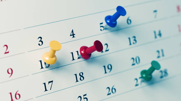 istock White Calendar With Colored Push Pins Showing Important Dates 1194395804