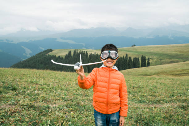 Young boy dreaming as one pilot
