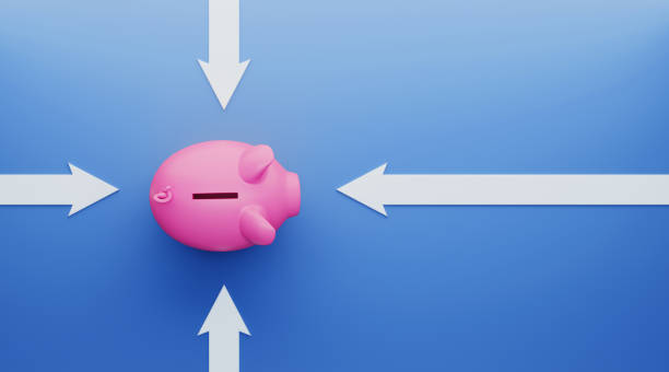istock Piggy Bank Surrounded by White Arrows over Blue Background 1194397318