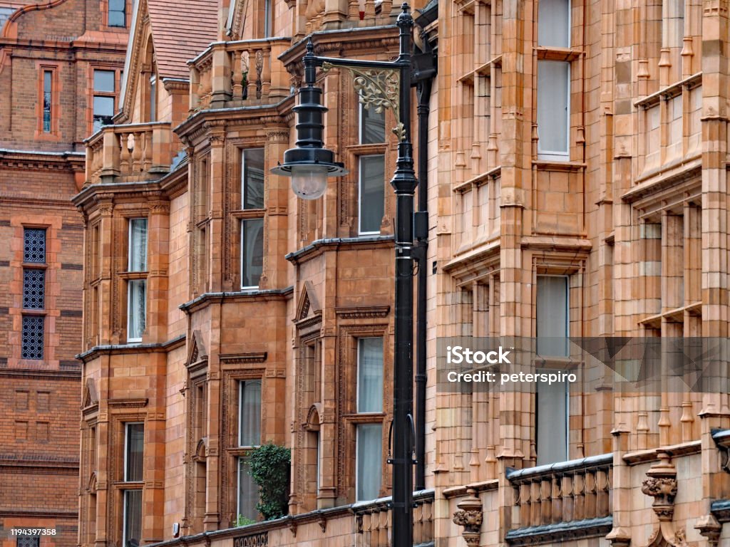 Colorful terracotta facades of apartment buildings in the Mayfair district of London, England Mayfair Stock Photo