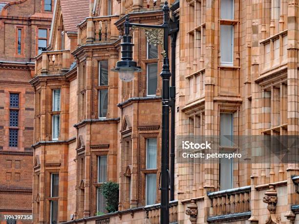 Colorful Terracotta Facades Of Apartment Buildings In The Mayfair District Of London England Stock Photo - Download Image Now