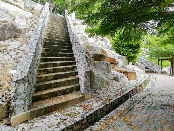 istock Stone steps up to the hill in the refreshing  park. 1194399254