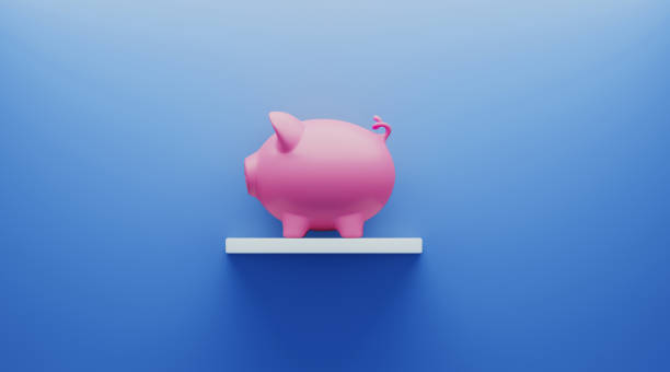 istock Piggy Bank over Blue Background 1194400027