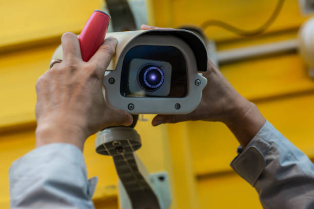 istock The technician is wearing accessories for the CCTV camera. 1194407167