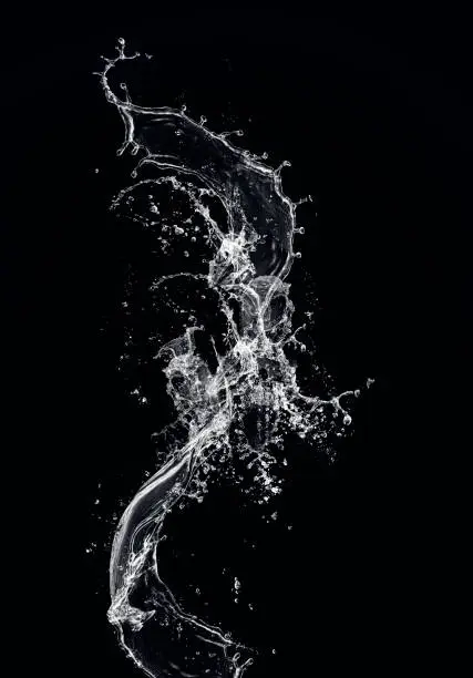 Photo of WATER SPLASH FLOWING WATER ON BLACK BACKGROUND