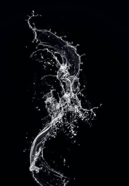 water splash flowing water on black background - water splashing spray drop imagens e fotografias de stock