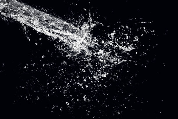 istock WATER SPLASH FLOWING WATER ON BLACK BACKGROUND 1194410291