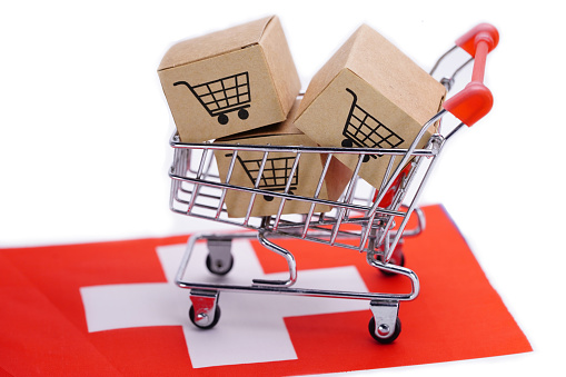 Box with shopping cart logo and Switzerland flag : Import Export Shopping online or eCommerce finance delivery service store product shipping, trade, supplier concept.