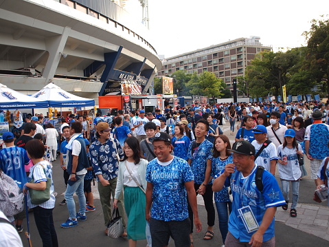 Yokohama, Japan - August 19, 2018: Fans of Japanese professional baseball team Yokohama DeNA BayStars outside the Yokohama Stadium before a game.