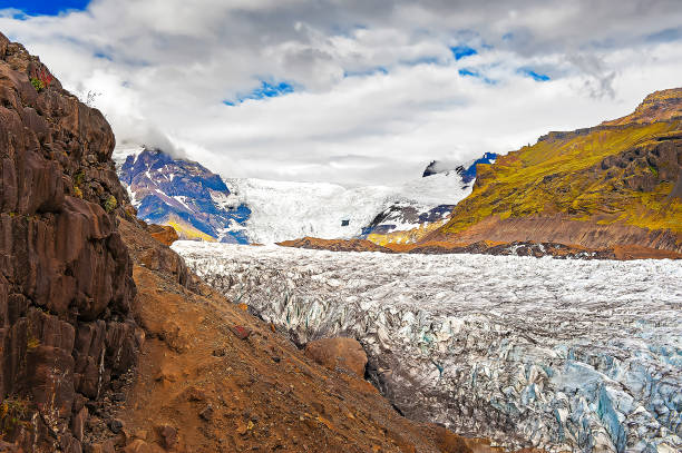 istock glacier moving along the mountain valley 1194415621