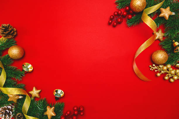 istock Christmas pine tree with xmas decoration on Red background 1194415838