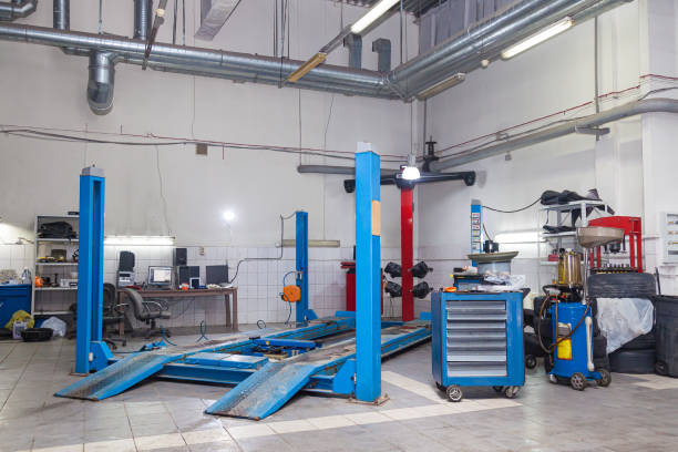 istock Blue stand wheel alignment convergence of the car during regular maintenance in the workshop for repair of vehicles . Auto service industry. 1194416548