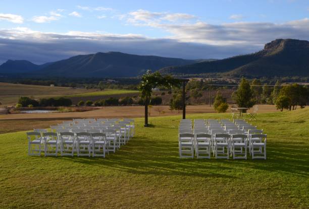 Early morning seating and wedding arch set out overlooking the Hunter Valley wine region for a ceremony later that day stock photo