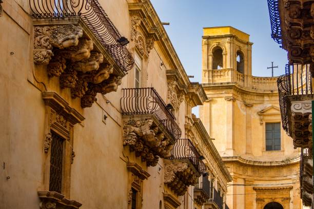Balconies in Baroque style of Via Nicolaci in Noto, Sicily, Italy stock photo