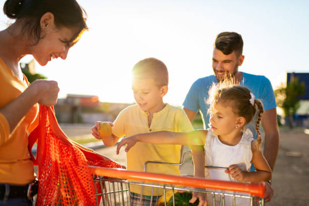 istock Family having fun after grocery shopping 1194420746