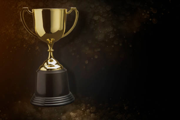 istock Golden trophy with golden bokeh as background. 1194422808