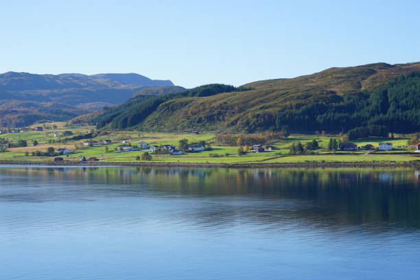 istock tranquil lake and village 1194424152