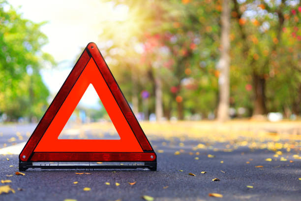 istock Red triangle, red emergency stop sign, red emergency symbol on road. With copy space for text or design 1194425843