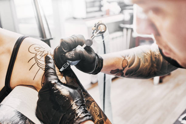 istock Tattooing a shoulder. Close-up shot 1194427410