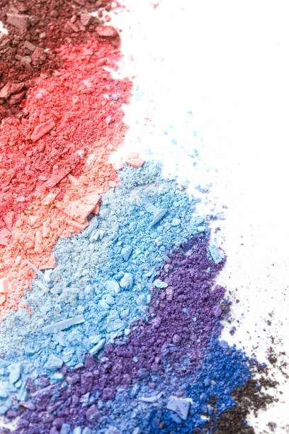 istock Multicolored crushed eyeshadows with brush isolated on white background. 1194428129