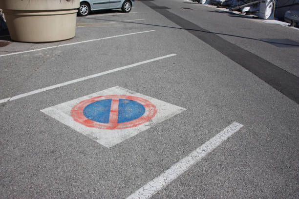istock Car parking space marked with prohibited parking marking 1194428234