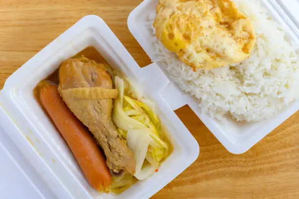 top view fast food of steamed chicken leg and sausage and fried egg and cabbage and rice