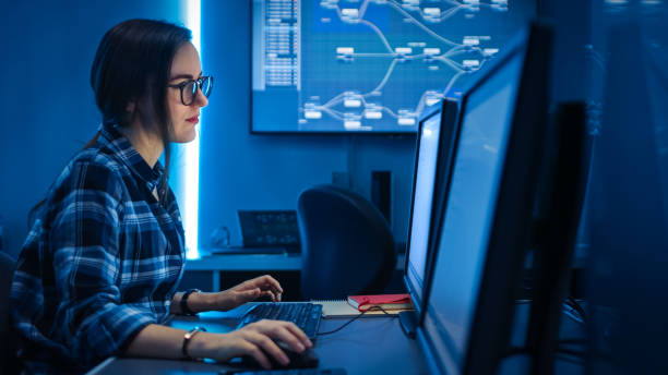 Smart Female IT Engineer / Programer Working on Desktop Comuter. Software Development / Coding/ Web Design / Database Architecture. Young Girl STEM Graduate Working Smart Female IT Engineer / Programer Working on Desktop Comuter. Software Development / Coding/ Web Design / Database Architecture. Young Girl STEM Graduate Working it programer working on desktop stock pictures, royalty-free photos & images
