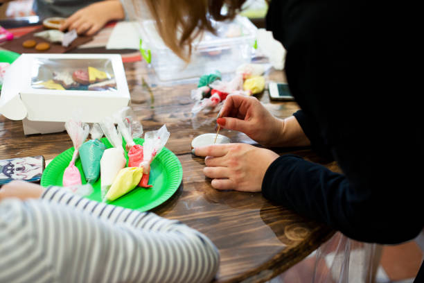 istock Master class on baking and painting gingerbread. Gingerbread cookies are the making process. 1194431689