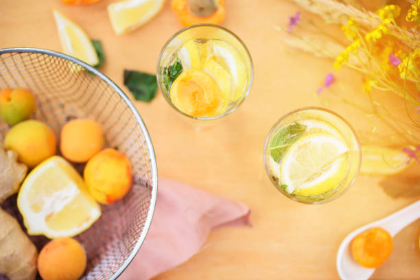 istock Summer lemonade with lemon, lime, ginger, with wildflowers on the table. Cooling drinks 1194431762