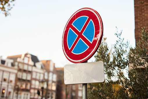 Still life shot of a clearway traffic sign in the city of Amsterdam, Netherlands