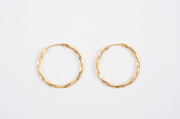 loop gold earrings. - gold earring imagens e fotografias de stock