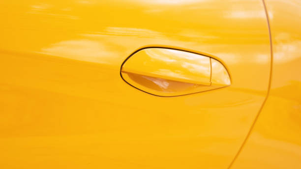 istock Orange car door and know 1194436710